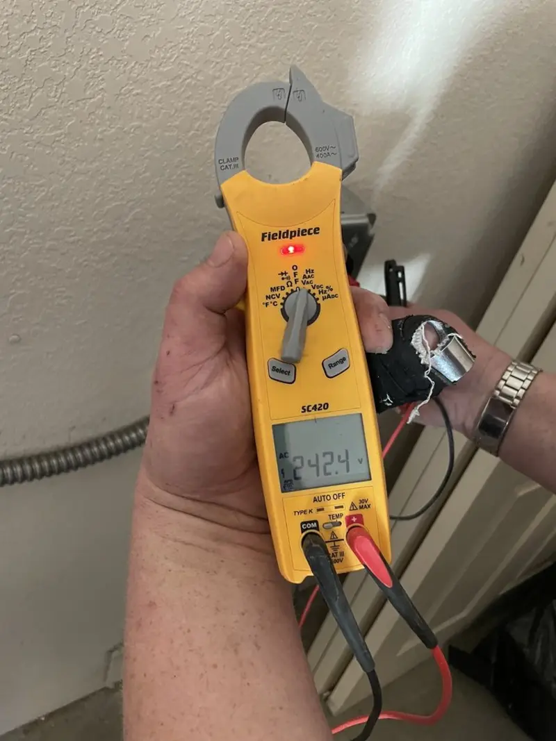 Voltage testing with clamp meter during Electrical Installation Services in Woods Cross